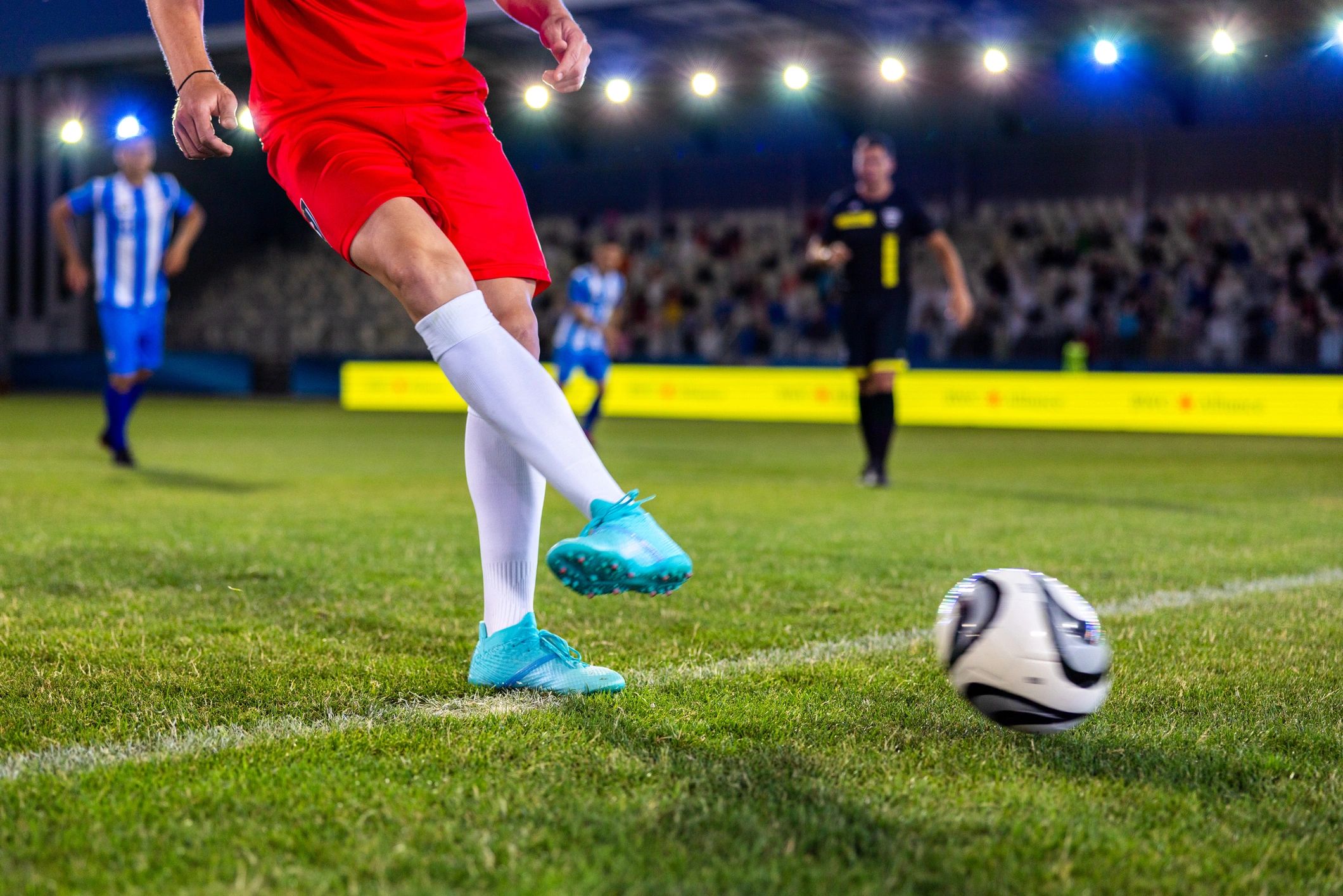 Footballer kicking the ball during play