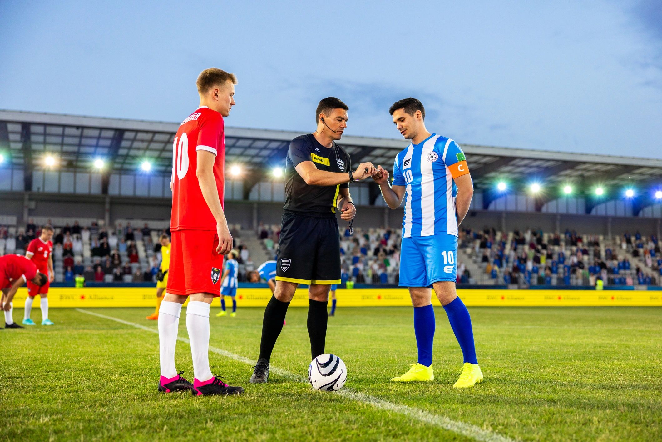 Match officials and captains before kickoff
